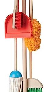 A set of toddler cleaning supplies including a broom, mom, brush, duster, and stand.