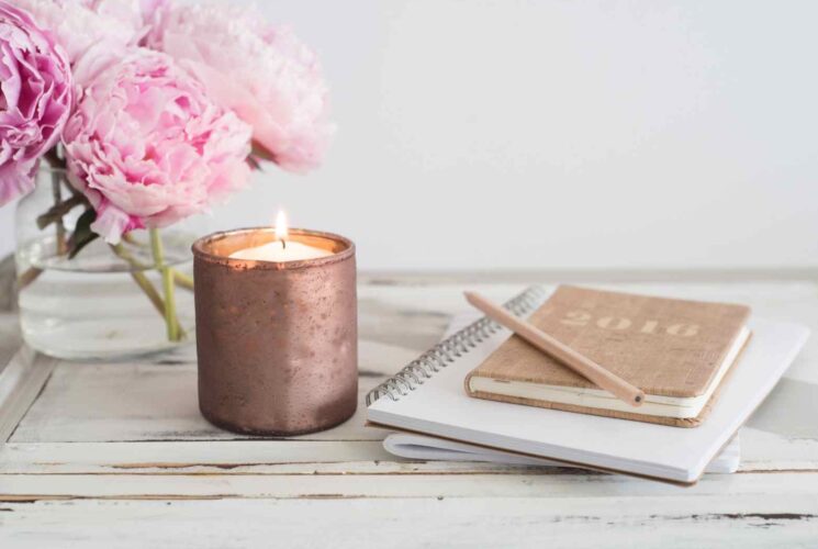 A natural organic beeswax candle on a table in a toxin free home.