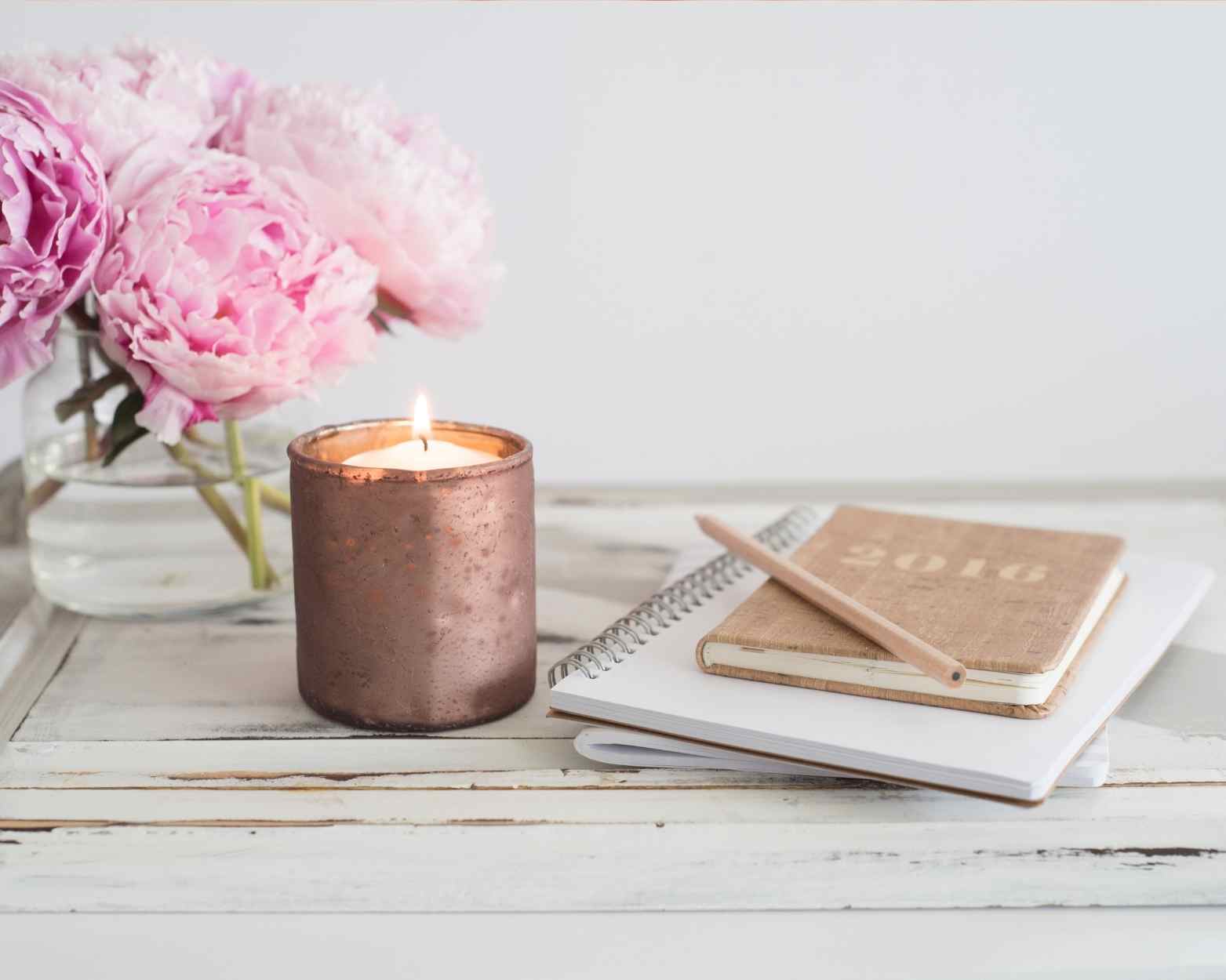 A natural organic beeswax candle on a table in a toxin free home.